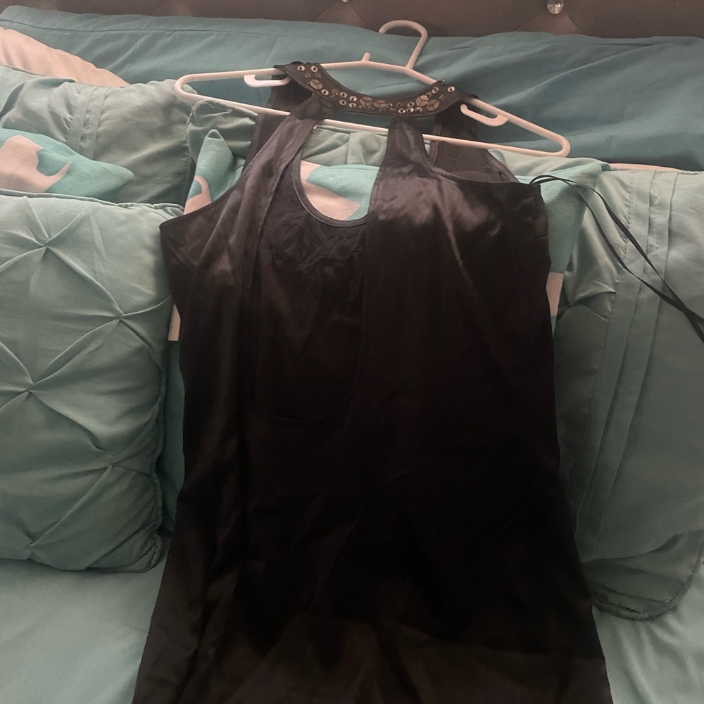 Black Sleeveless Blouse with Embellished Neckline